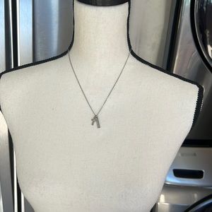 Beautiful and delicate Charming Charlie silver tone cross & faith necklace